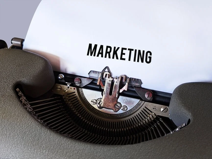 Man analyzing marketing content strategies using sticky notes on a whiteboard.